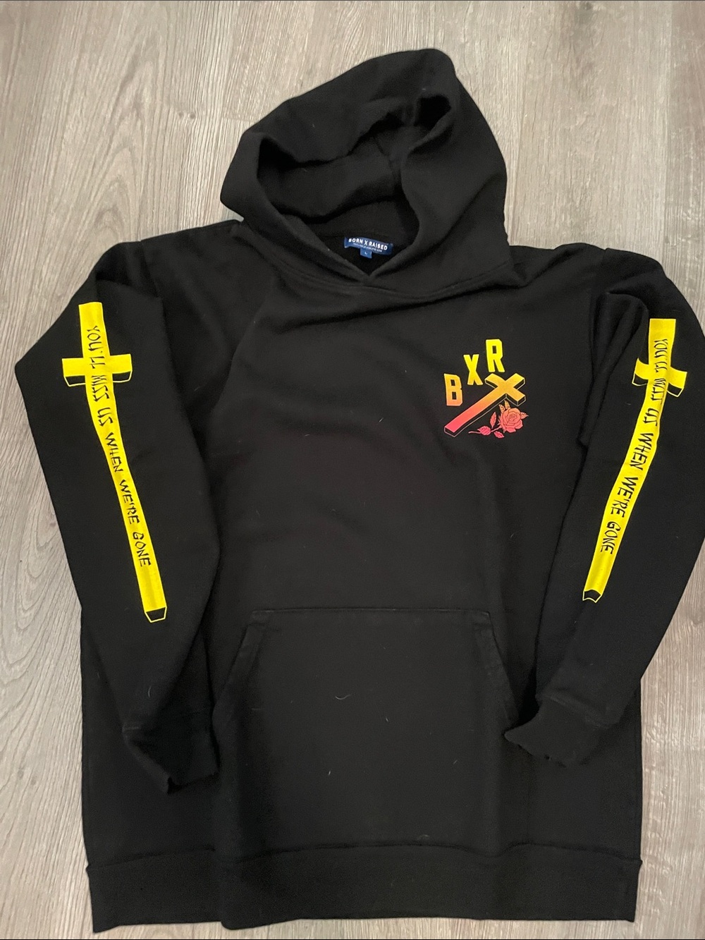 BORN X RAISED Black Hoodie with Yellow Sleeve Stripes and Chest Graphic